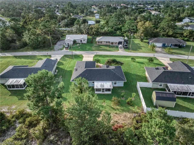 Aerial view of residential area with a tree filled landscape