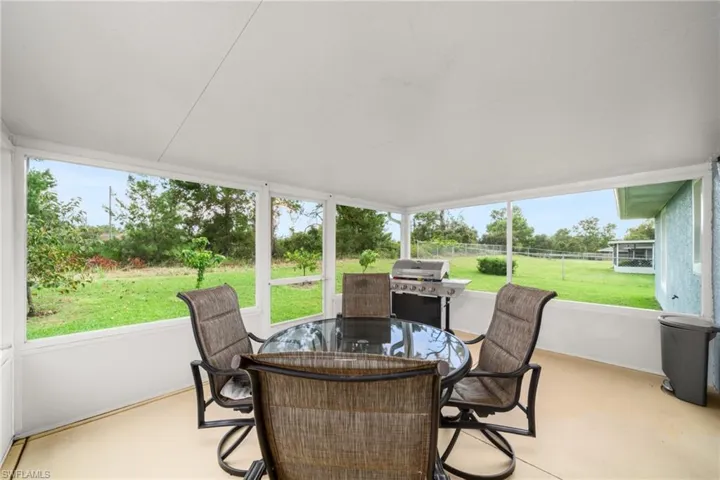 Sunroom with outdoor dining space