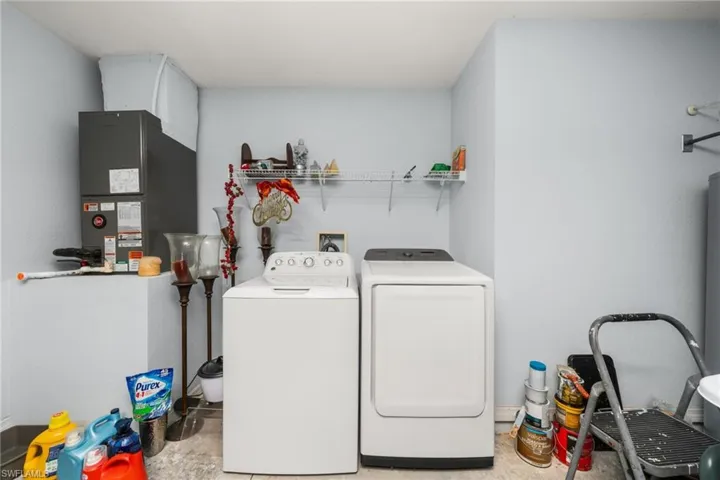 Washroom with washer and clothes dryer and heating unit