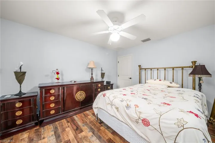 Bedroom featuring dark wood finished floors and ceiling fan