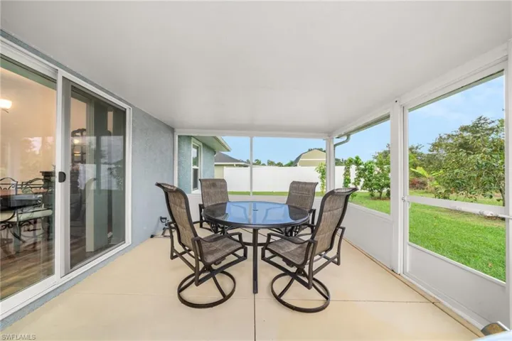 Sunroom / solarium featuring outdoor dining space