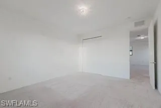Spare room with light carpet