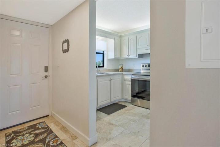 Walk in to beautiful flooring, stainless steel appliances, most desired white cabinetry