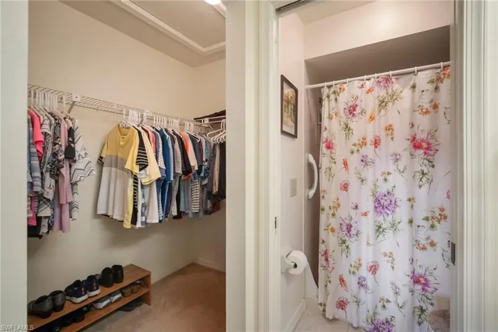 Bathroom featuring curtained shower