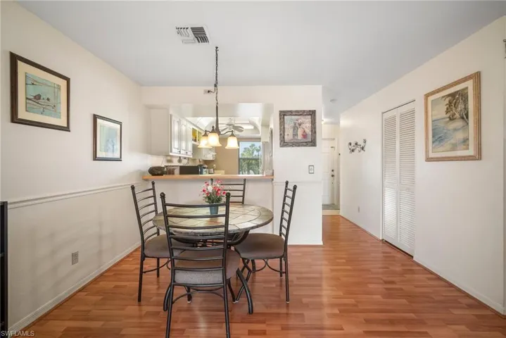 Dining area featuring a notable chandelier and light hardwood / wood-style flooring