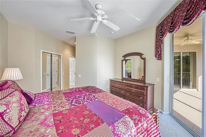 Carpeted bedroom with access to exterior, a closet, and ceiling fan