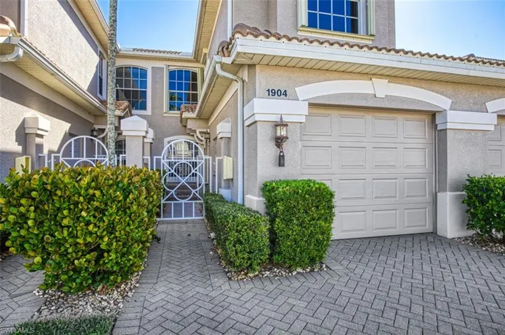 View of exterior entry featuring a garage
