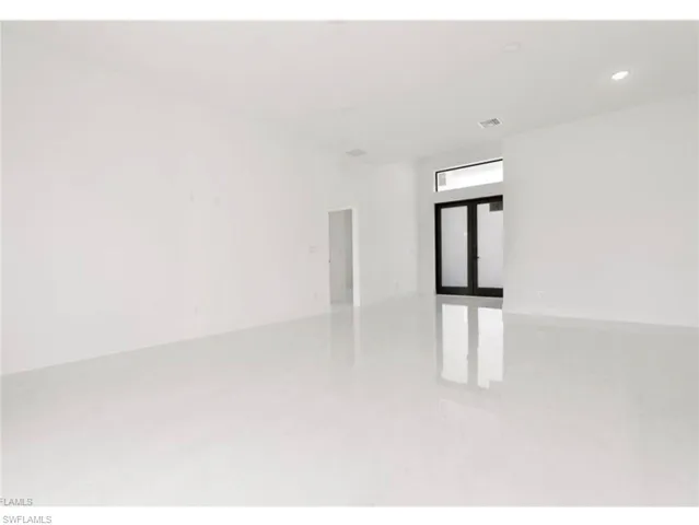 Spare room with french doors and recessed lighting