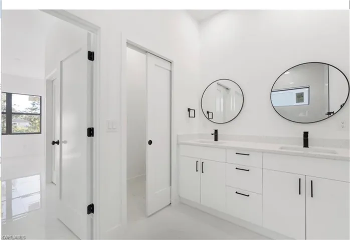 Bathroom featuring double vanity