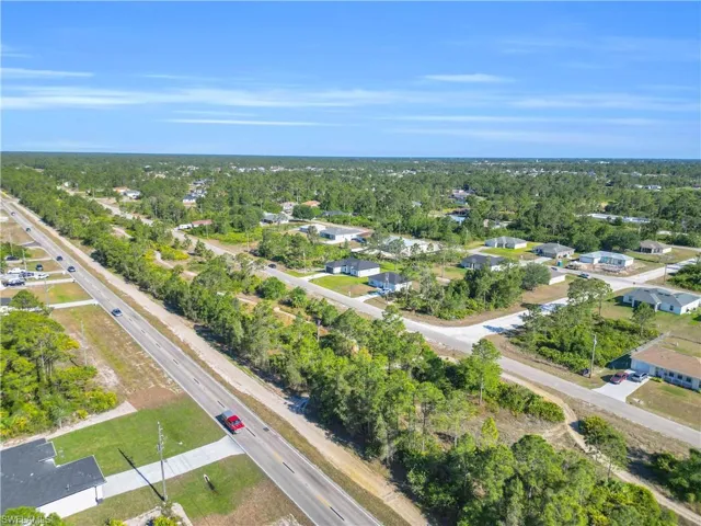 Aerial view of residential area featuring a major roadway
