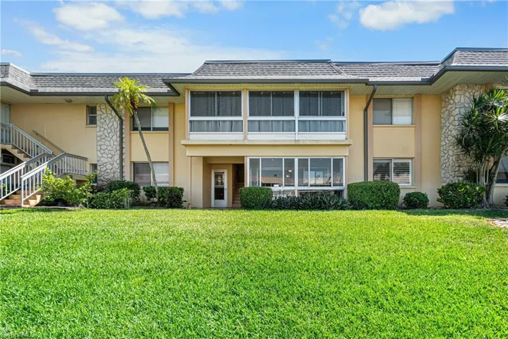 View of front of house with a front lawn