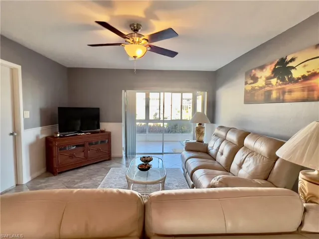 Living room featuring ceiling fan