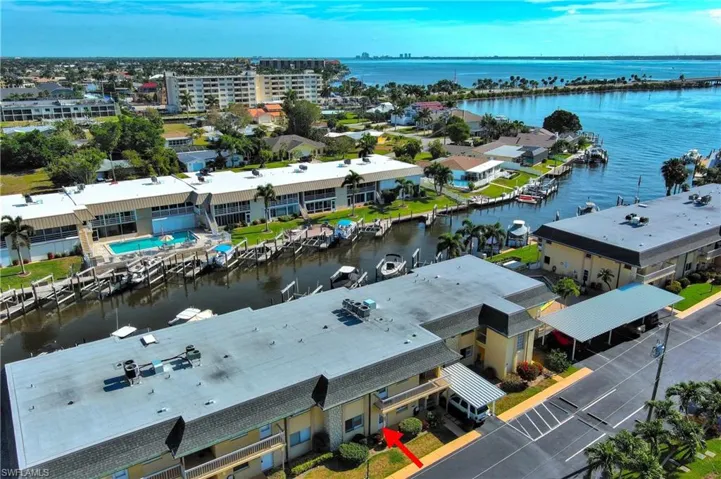 Birdseye view of property with a water view
