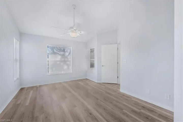 Unfurnished room with light wood-style floors and ceiling fan