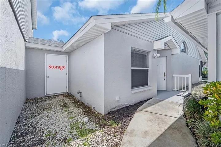 Entrance to property featuring stucco siding