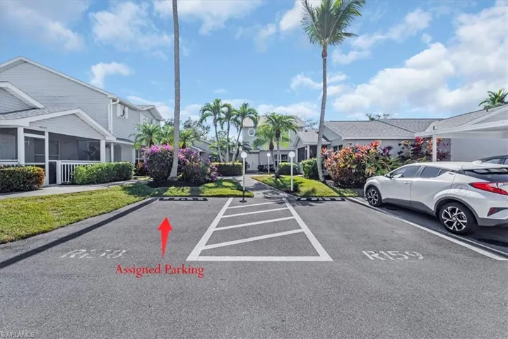 Uncovered parking lot with a residential view