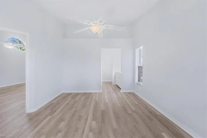 Unfurnished room featuring light wood finished floors and a ceiling fan