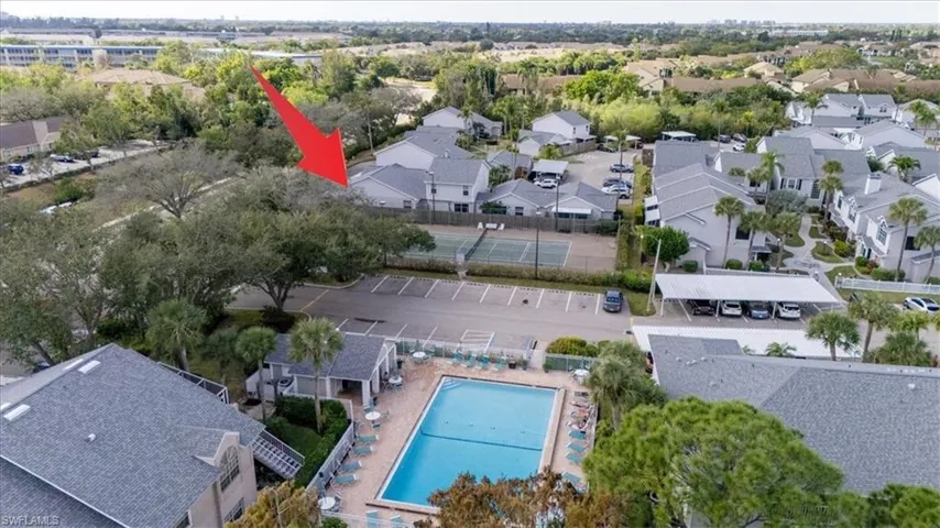 Aerial perspective of suburban area with a pool