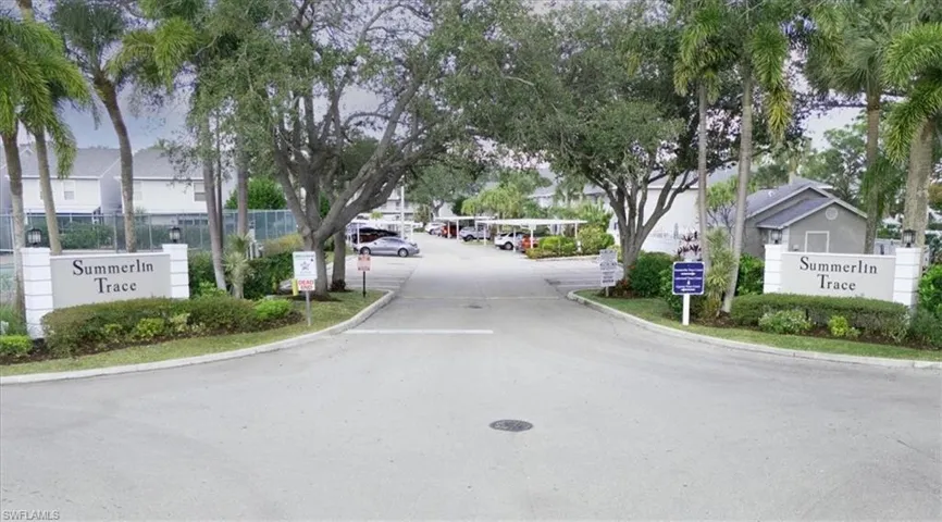 View of asphalt street with curbs and a residential view