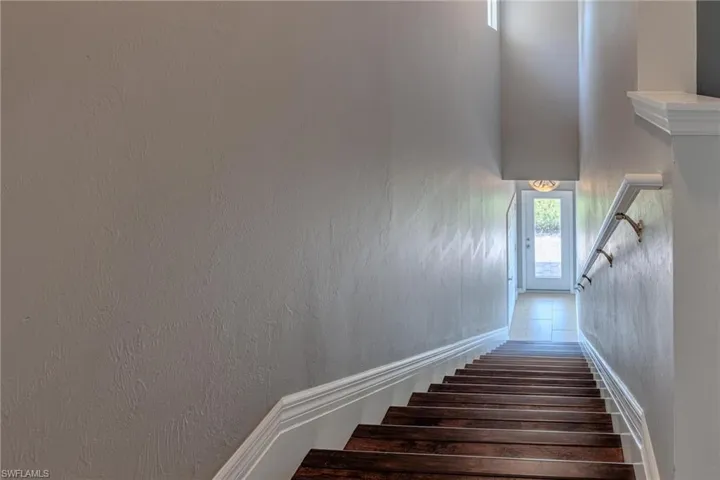 Stairs leading down to garage & entry