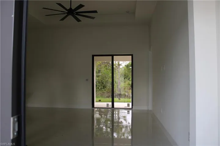 Spacious interior featuring reflective tile flooring
