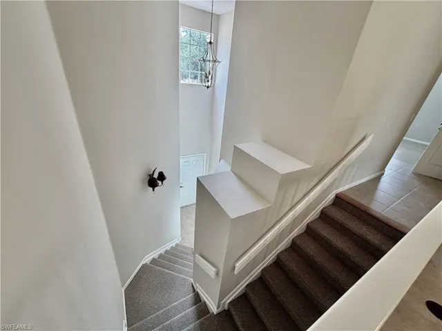 Stairway view to 1st floor garage and entry