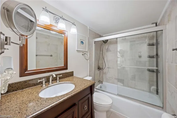 Vanity with a polished countertop and an undermount sink