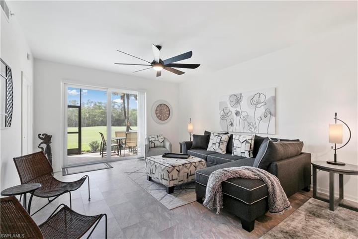 Open concept living area with impact resistant sliders