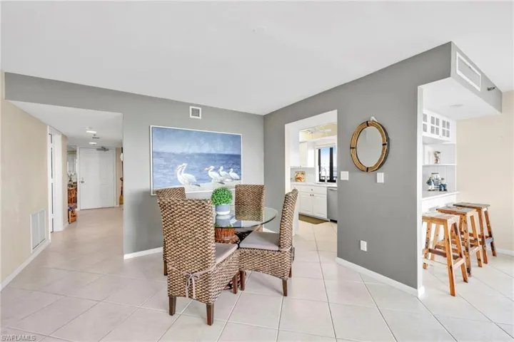 Dining room with light tile patterned floors