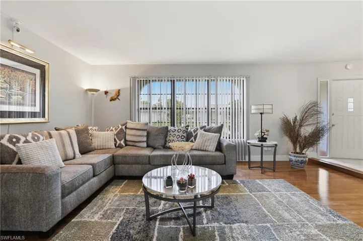 Living room featuring wood finished floors and baseboards