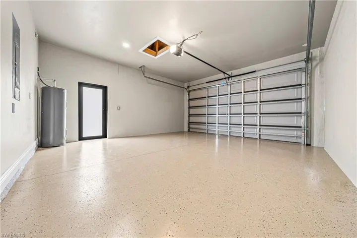 Garage featuring water heater