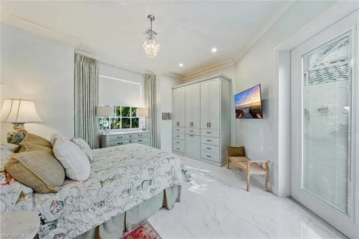 Stunning Guest bedroom with custom furnishings and pool view!