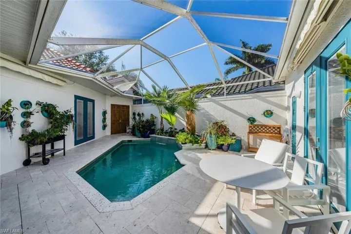 View of pool with a patio, french doors, and a lanai