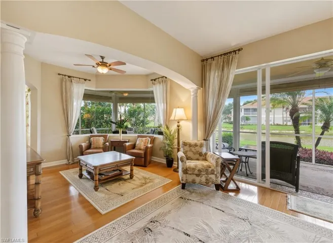 Living space featuring wood-finish flooring and neutral wall tones
