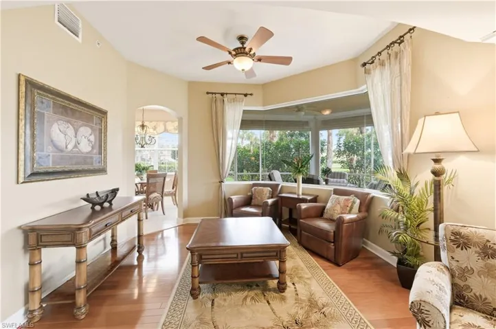 Living area with wood-finish flooring and neutral wall tones