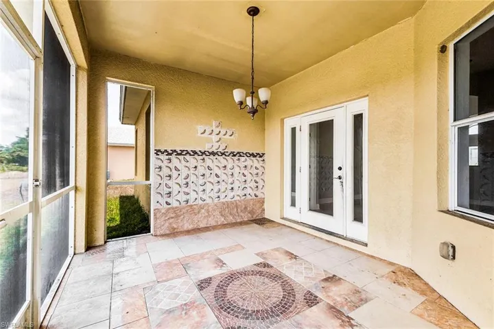 Unfurnished sunroom with french doors and plenty of natural light