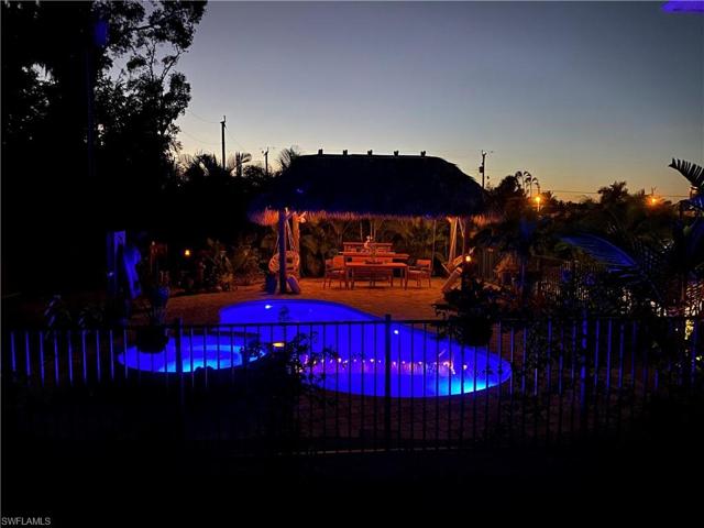 Pool and Tiki hut at night