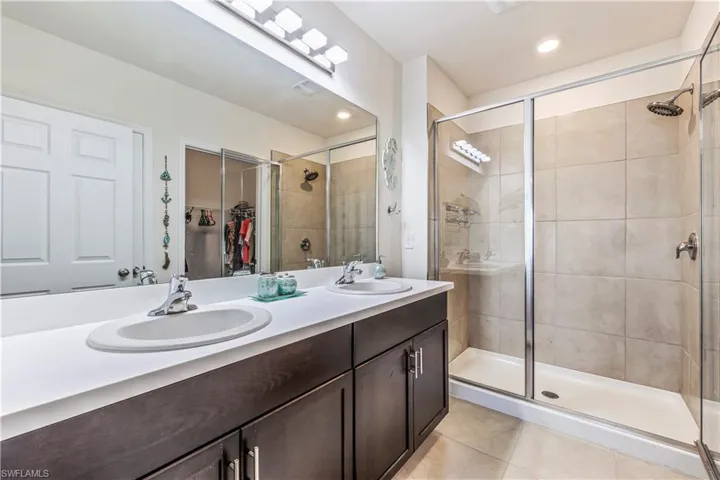 Massage style shower head, walk-in closet, upgraded lighting and dual sinks