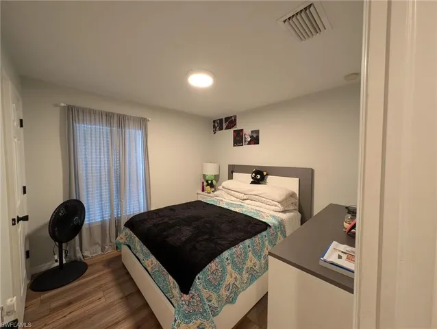 Bedroom with wood finished floors
