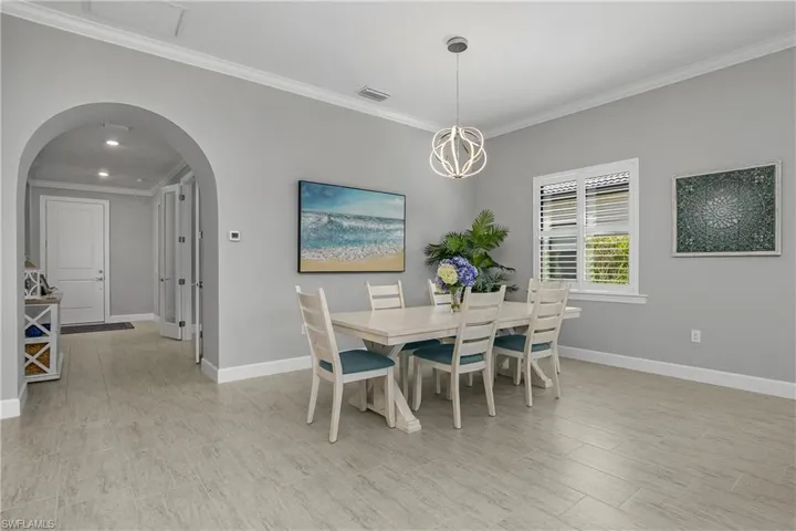 Family dining area accented by designer LED chandelier.