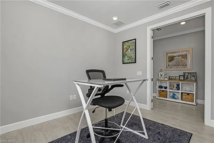 Den, featuring double french entry doors is the perfect home office.