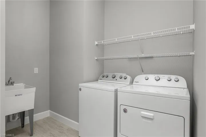 Oversized laundry room with utility sink.