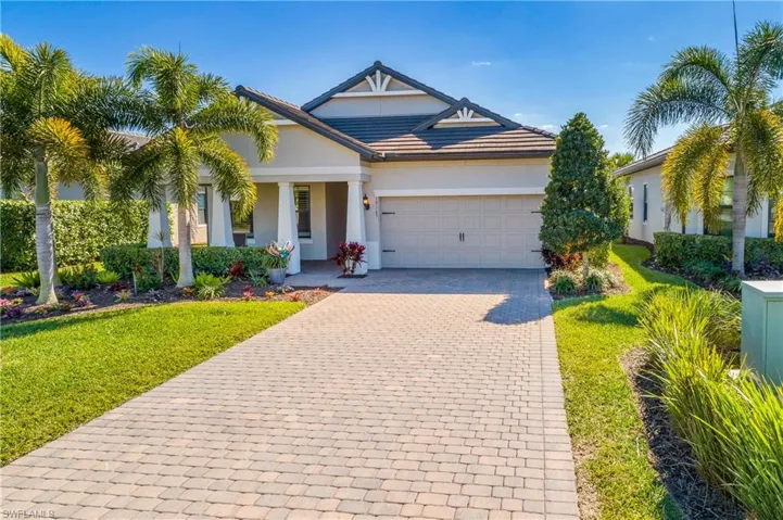 Larger lot with longer than typical driveway and professional landscaping.
