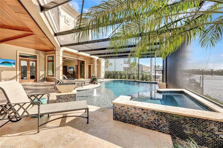 This view features the large integrated spa, the doors to the Study, sliders to the Family room, the Pool Bath, Storage Room and Outdoor Shower.