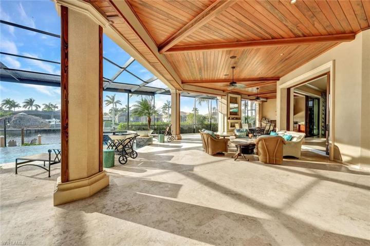 Large covered lanai has multiple areas to entertain and unwind