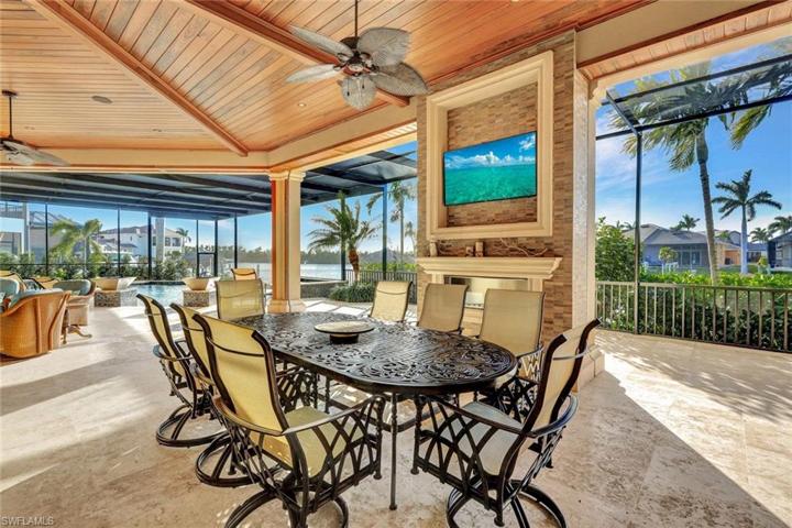 Large Covered Lanai Dining area seats 8 and overlooks the heated saltwater pool and spa.