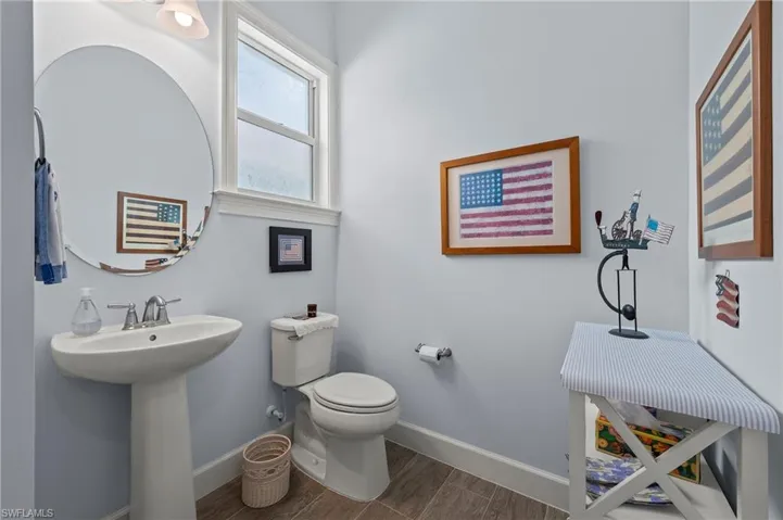 Bathroom featuring sink, hardwood / wood-style floors, and toilet