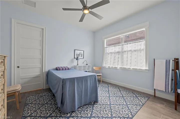 Bedroom featuring light hardwood / wood-style flooring and ceiling fan