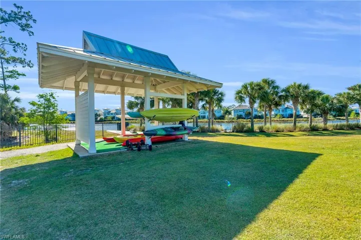View of home's community featuring a water view, a gazebo, and a lawn