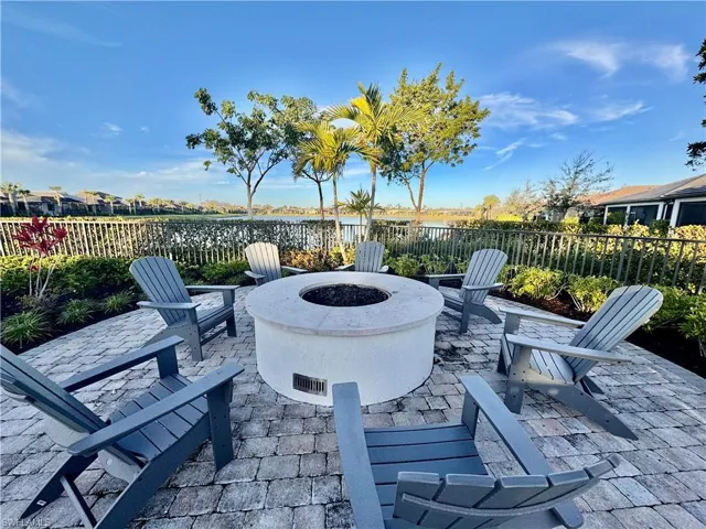 View of patio / terrace with a water view and a fire pit